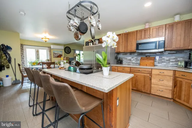 a view of a dining room with furniture and a window