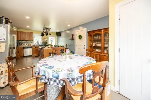 a kitchen with a refrigerator a sink and a stove