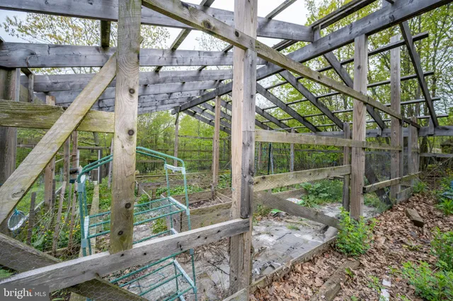 a aerial view of a house next to a yard