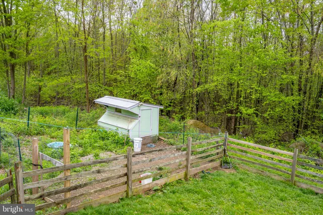a aerial view of a house with a yard