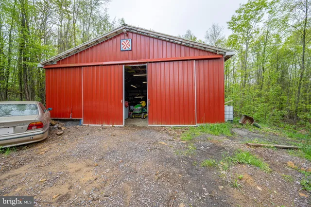 a view of a backyard with table and chairs