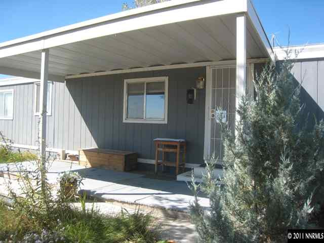 6263 Jacobs Road Fallon, NV 89406 - Photo 3 of 13 a backyard of a house with outdoor seating and trees