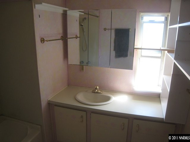 6263 Jacobs Road Fallon, NV 89406 - Photo 5 of 13 a bathroom with a sink and mirror