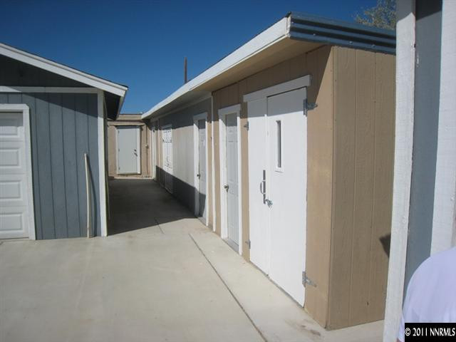 6263 Jacobs Road Fallon, NV 89406 - Photo 7 of 13 a view of a house with a wooden door