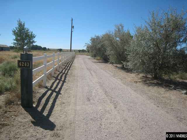 6263 Jacobs Road Fallon, NV 89406 - Photo 9 of 13 a view of a backyard with wooden fence