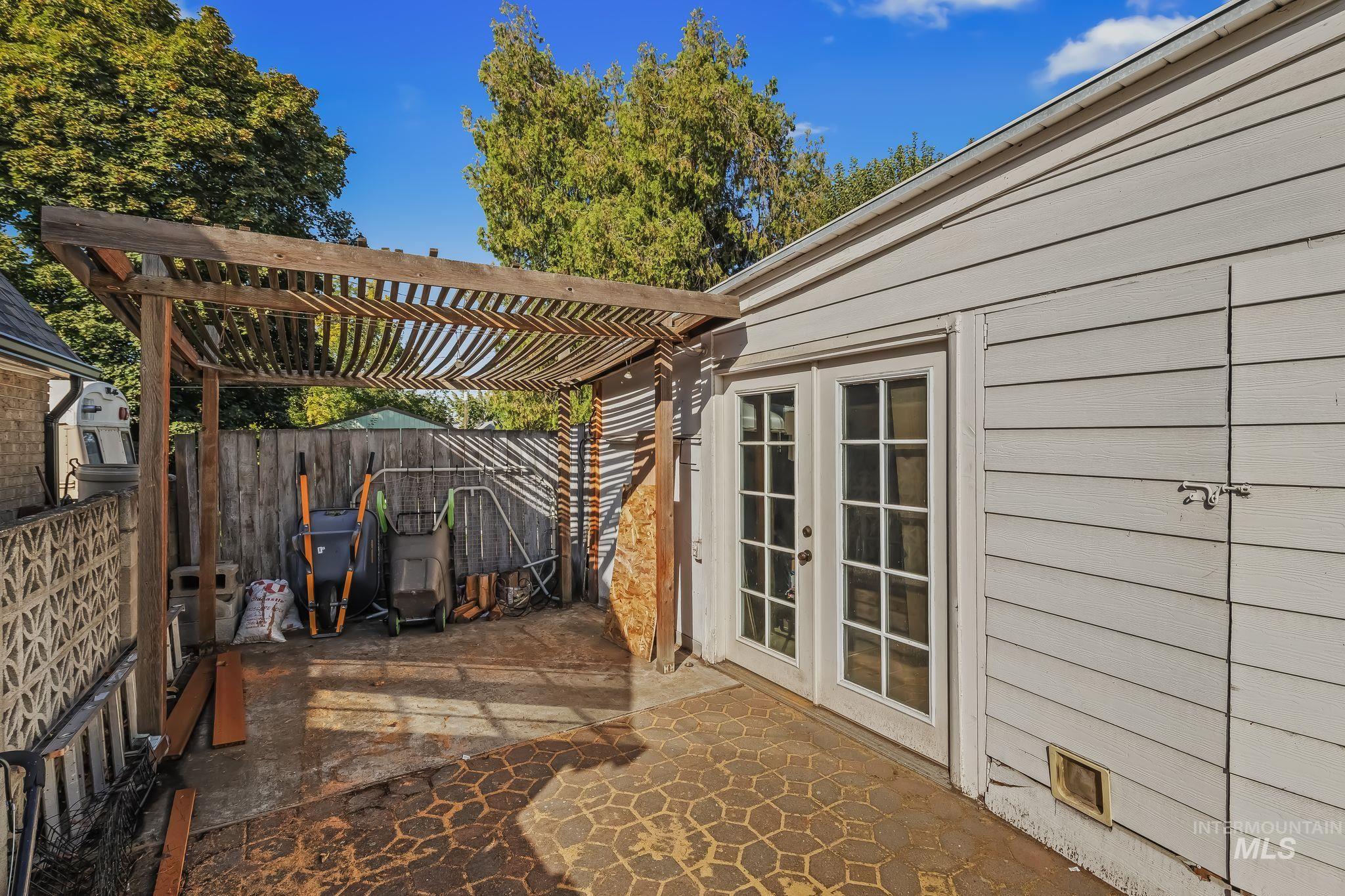 420 4th Street Lewiston, ID 83501 - Photo 38 of 38 Patio area featuring a wood pergola and a concrete patio with an imprinted geometric pattern