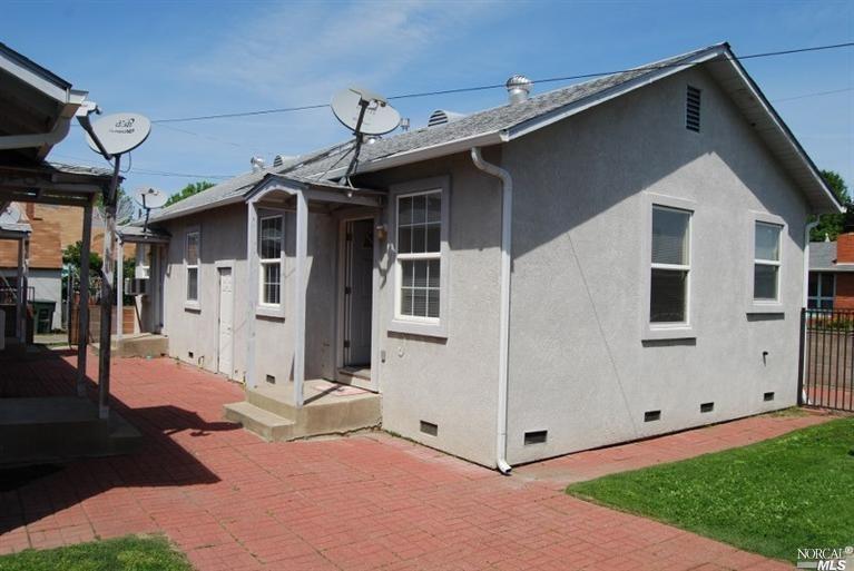 148 North 3rd Street, Unit C Rio Vista, CA 94571 - Photo 1 of 3 a view of a white house with many windows