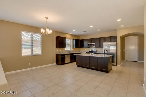 a large kitchen with stainless steel appliances lots of counter top space