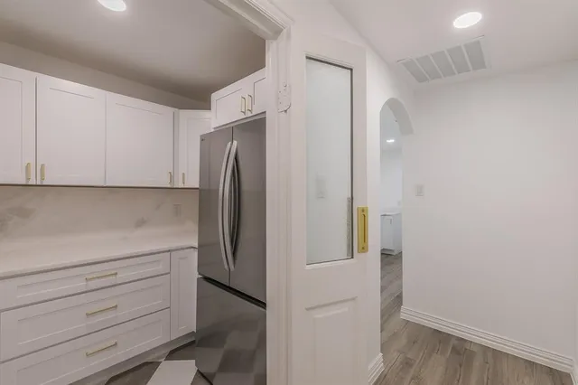 a view of cabinets and wooden floor