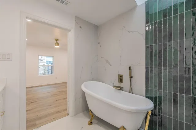 a bathroom with a toilet sink and shower