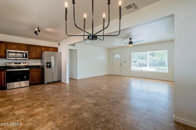 a view of a kitchen with a stove cabinets and wooden floor