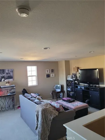 a bed room with bed and a window