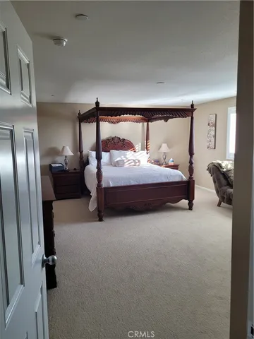 a bedroom with bed and window