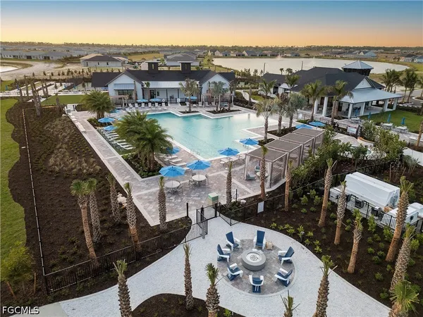 a view of a swimming pool with an outdoor seating
