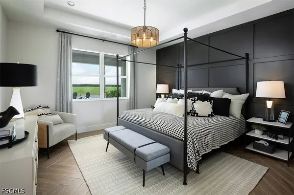 a bedroom with a bed a couch and a window