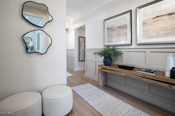 a bedroom with a bed couch and a window