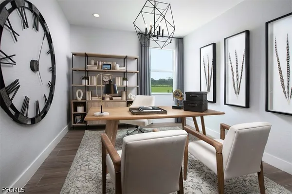 a kitchen with a refrigerator and cabinets