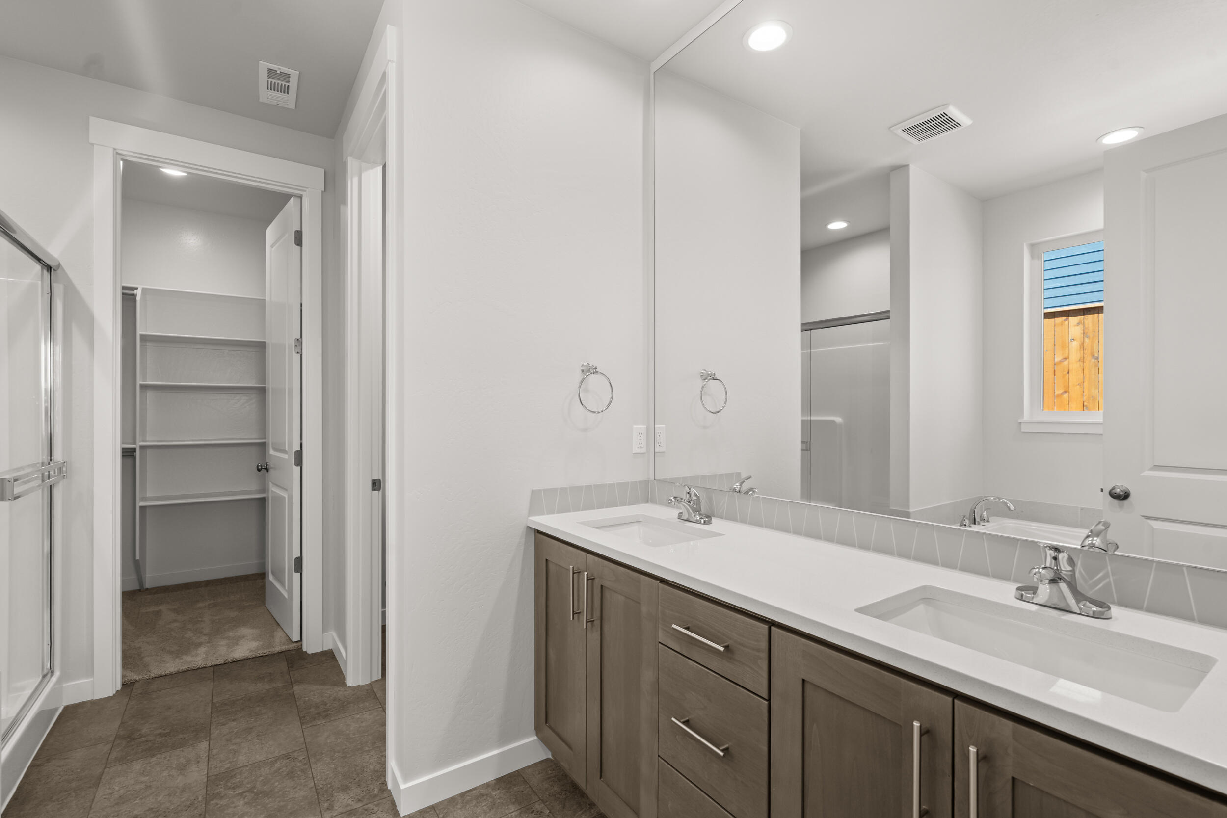 1141 Pumpkin Ridge, Unit 320 Eagle Point, OR 97524 - Photo 13 of 25 a bathroom with a granite countertop sink mirror and double
