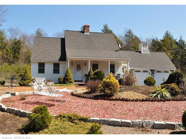 245 Monson Road Stafford, CT 06076 - Photo 1 of 1 a front view of a house with a yard