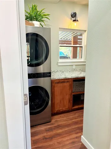 a view of a bedroom with a washer and dryer