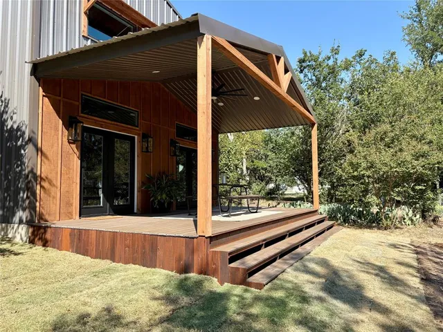 a view of a small house with a outdoor space