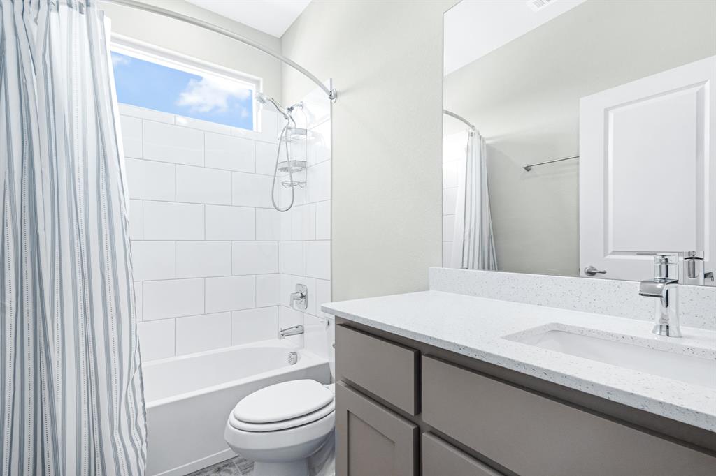 15501 Balham Path Fort Worth, TX 76247 - Photo 13 of 22 a bathroom with a sink a toilet and shower