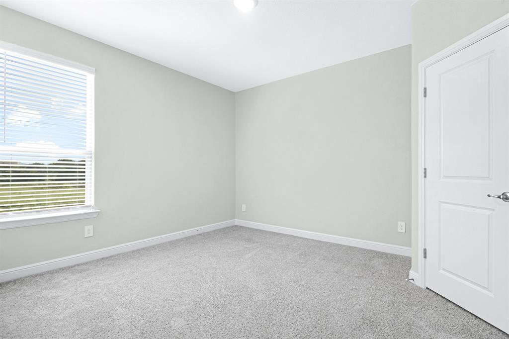 15501 Balham Path Fort Worth, TX 76247 - Photo 14 of 22 a view of an empty room with a window