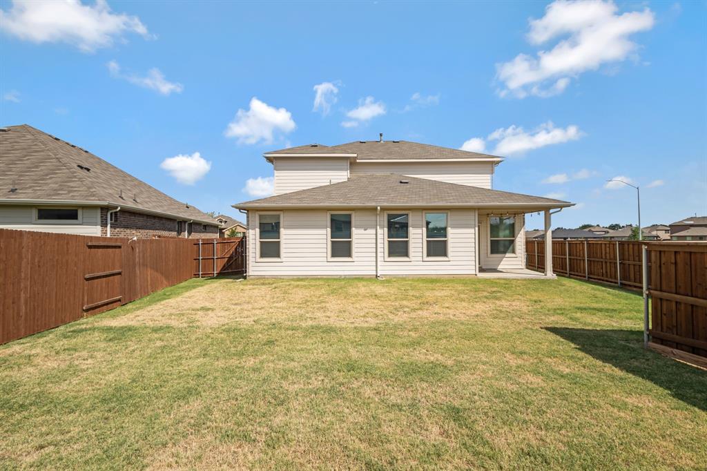15501 Balham Path Fort Worth, TX 76247 - Photo 15 of 22 a view of a yard in front of a house