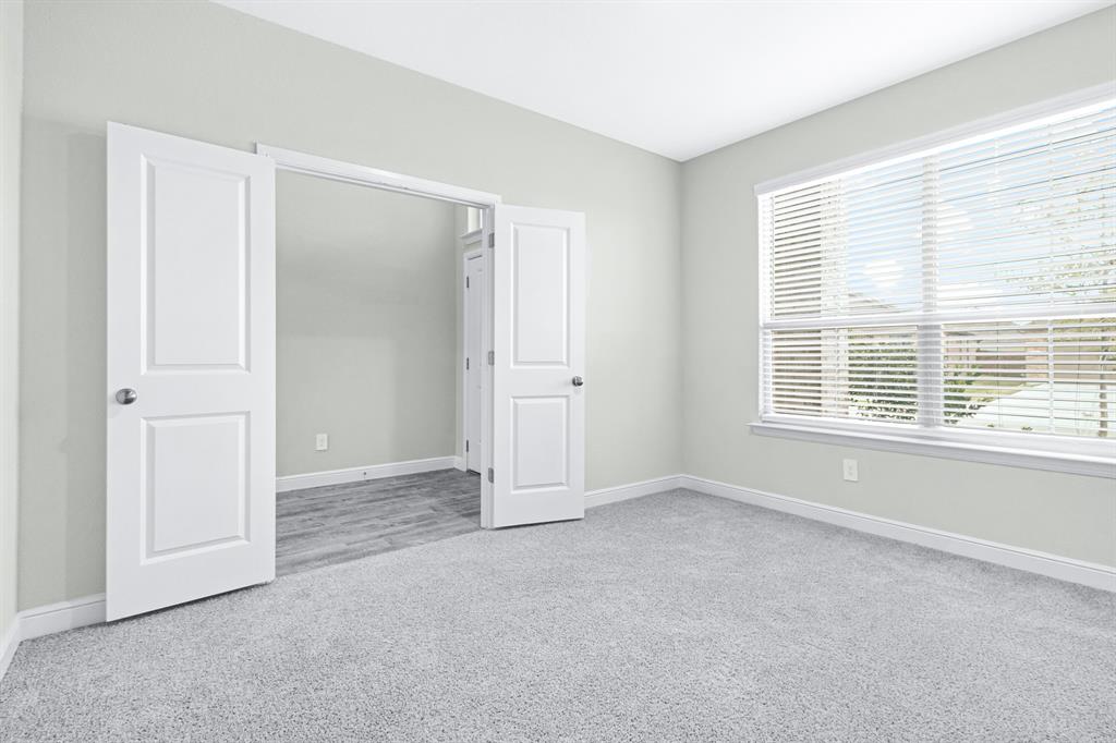 15501 Balham Path Fort Worth, TX 76247 - Photo 2 of 22 an empty room with windows and closet