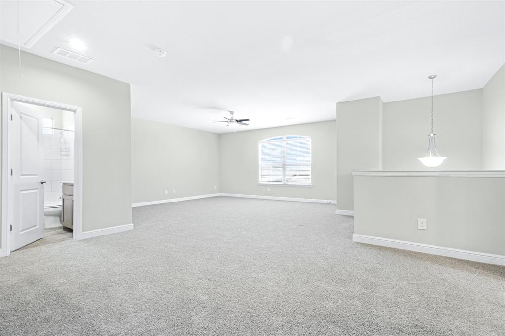 15501 Balham Path Fort Worth, TX 76247 - Photo 9 of 22 an empty room with a empty space and windows