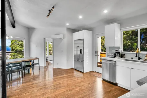 a view of kitchen with cabinets and wooden floor