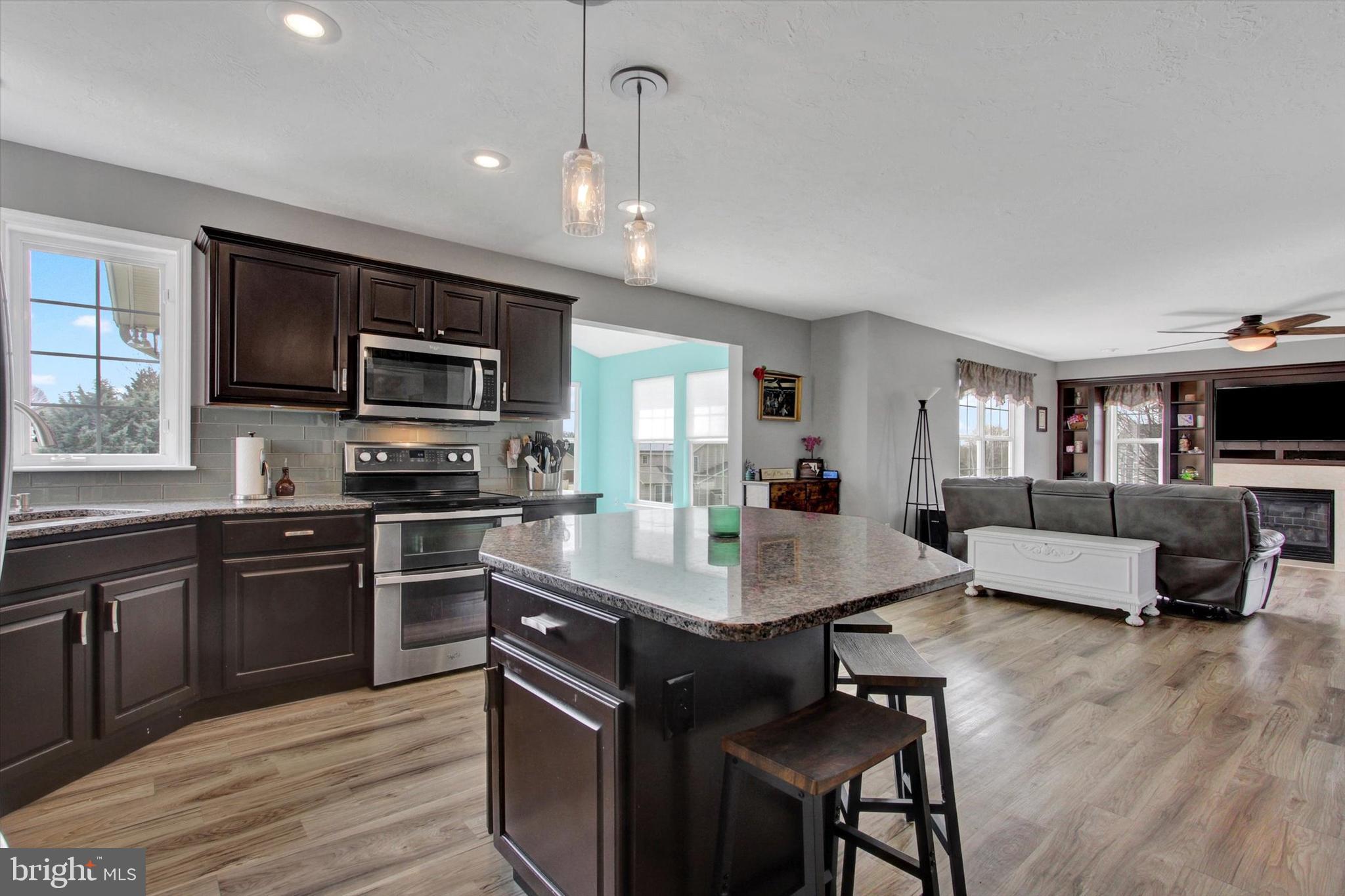 5010 Grandview Road Hanover, PA 17331 - Photo 14 of 42 a large kitchen with kitchen island white cabinets and stainless steel appliances