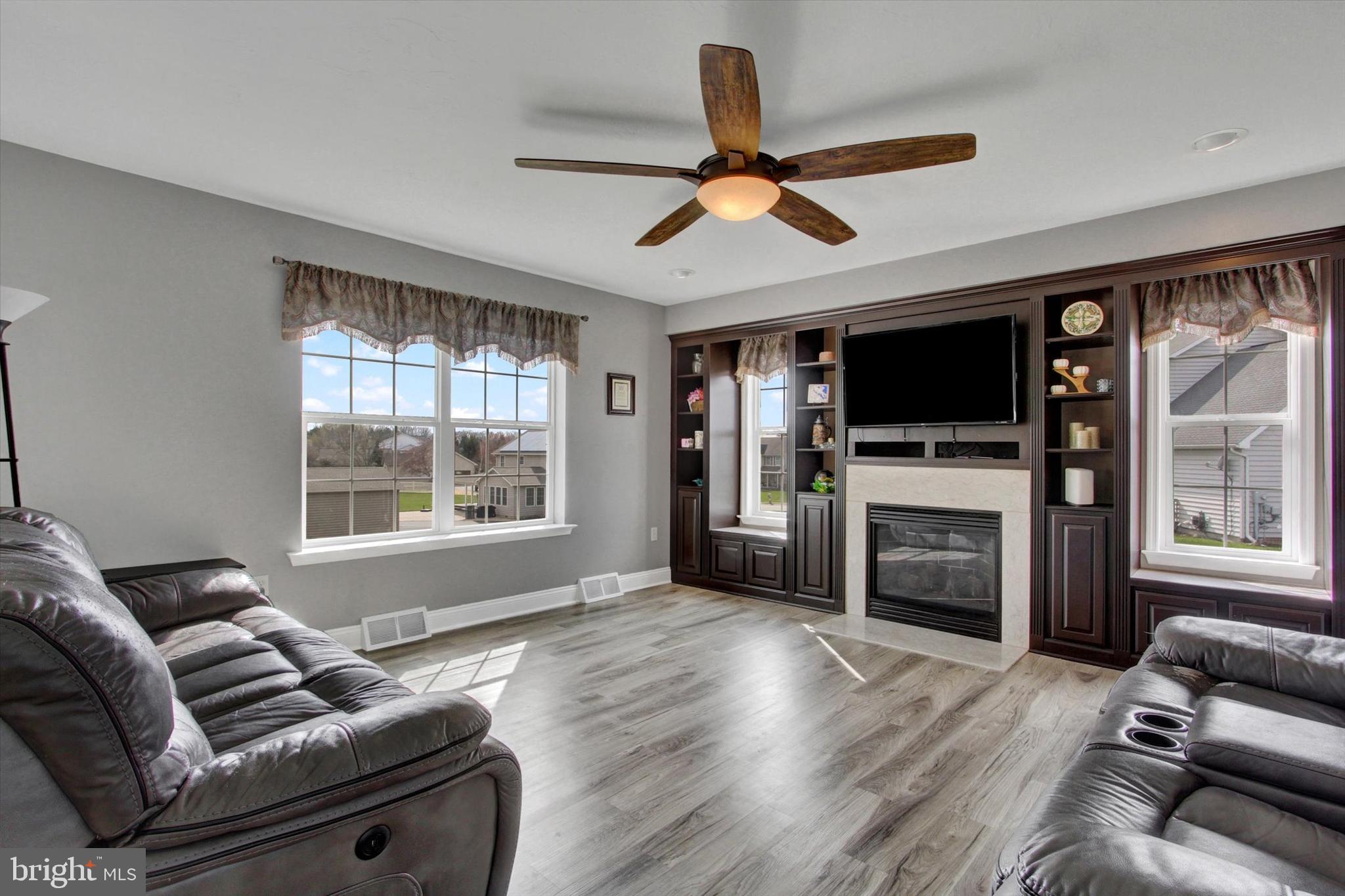 5010 Grandview Road Hanover, PA 17331 - Photo 19 of 42 a living room with furniture a flat screen tv and a fireplace