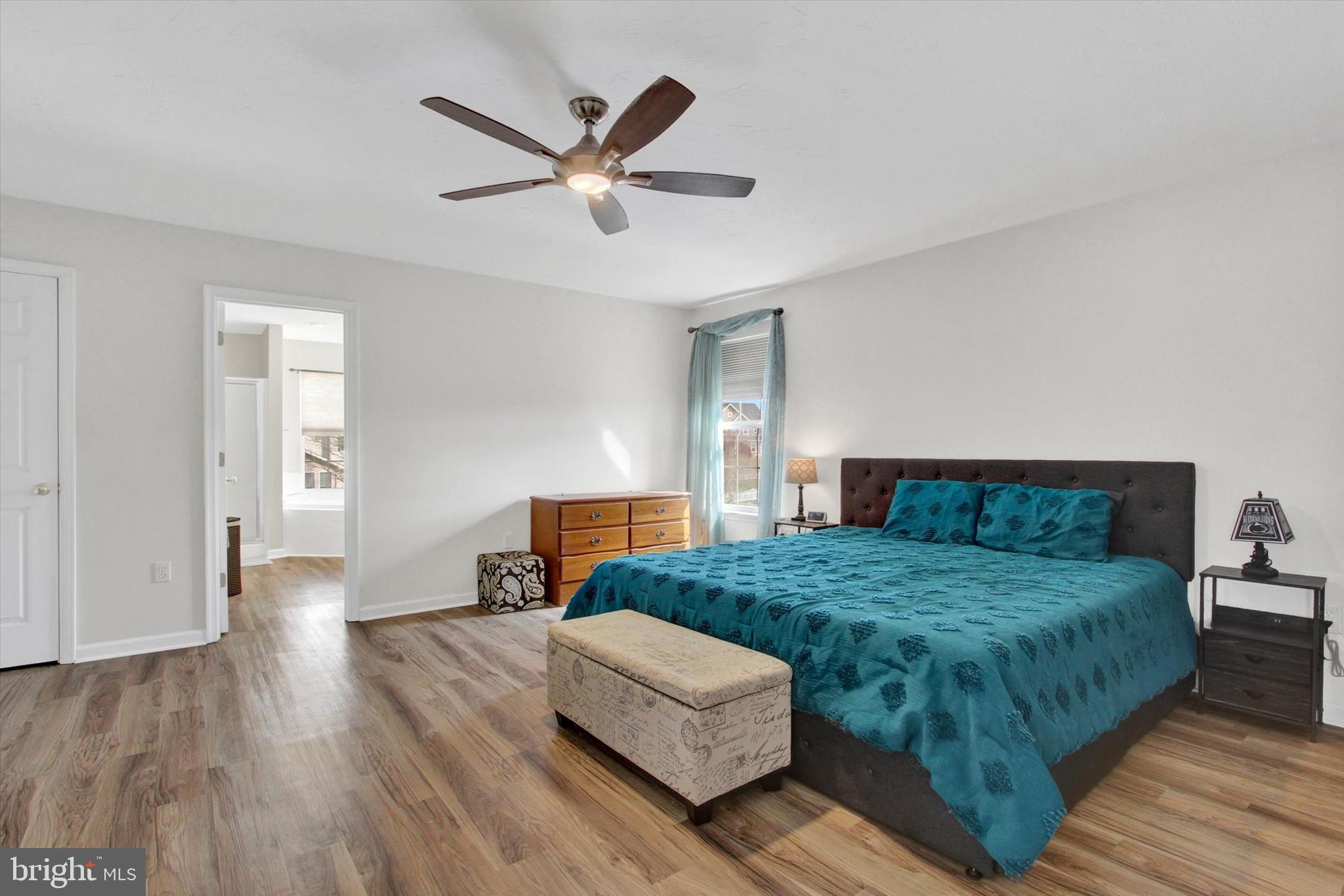 5010 Grandview Road Hanover, PA 17331 - Photo 25 of 42 a bedroom with a bed and a chandelier