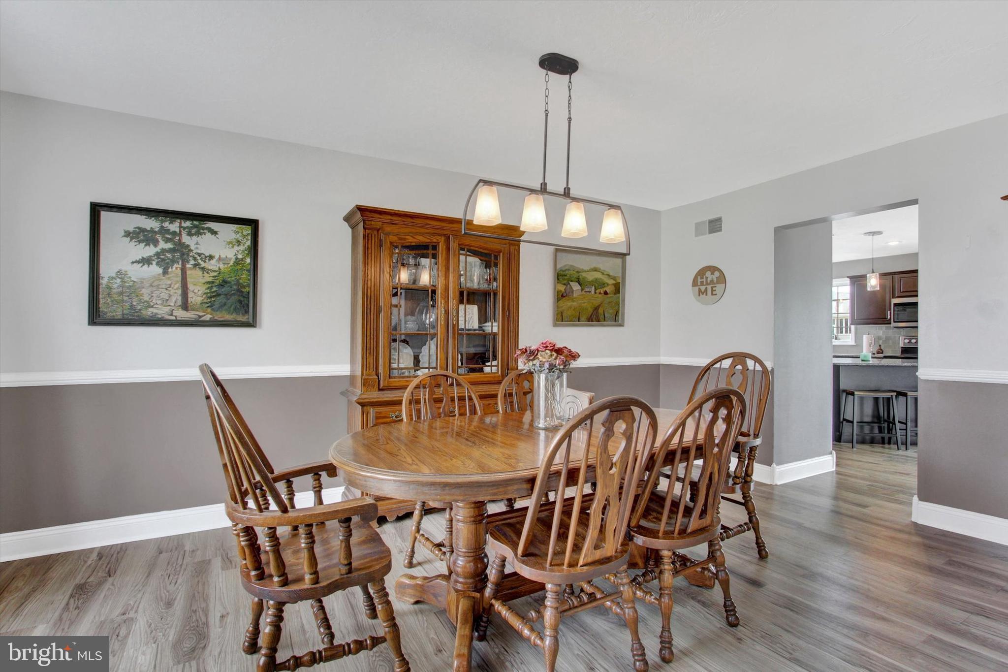 5010 Grandview Road Hanover, PA 17331 - Photo 8 of 42 a view of a dining room with furniture window and wooden floor