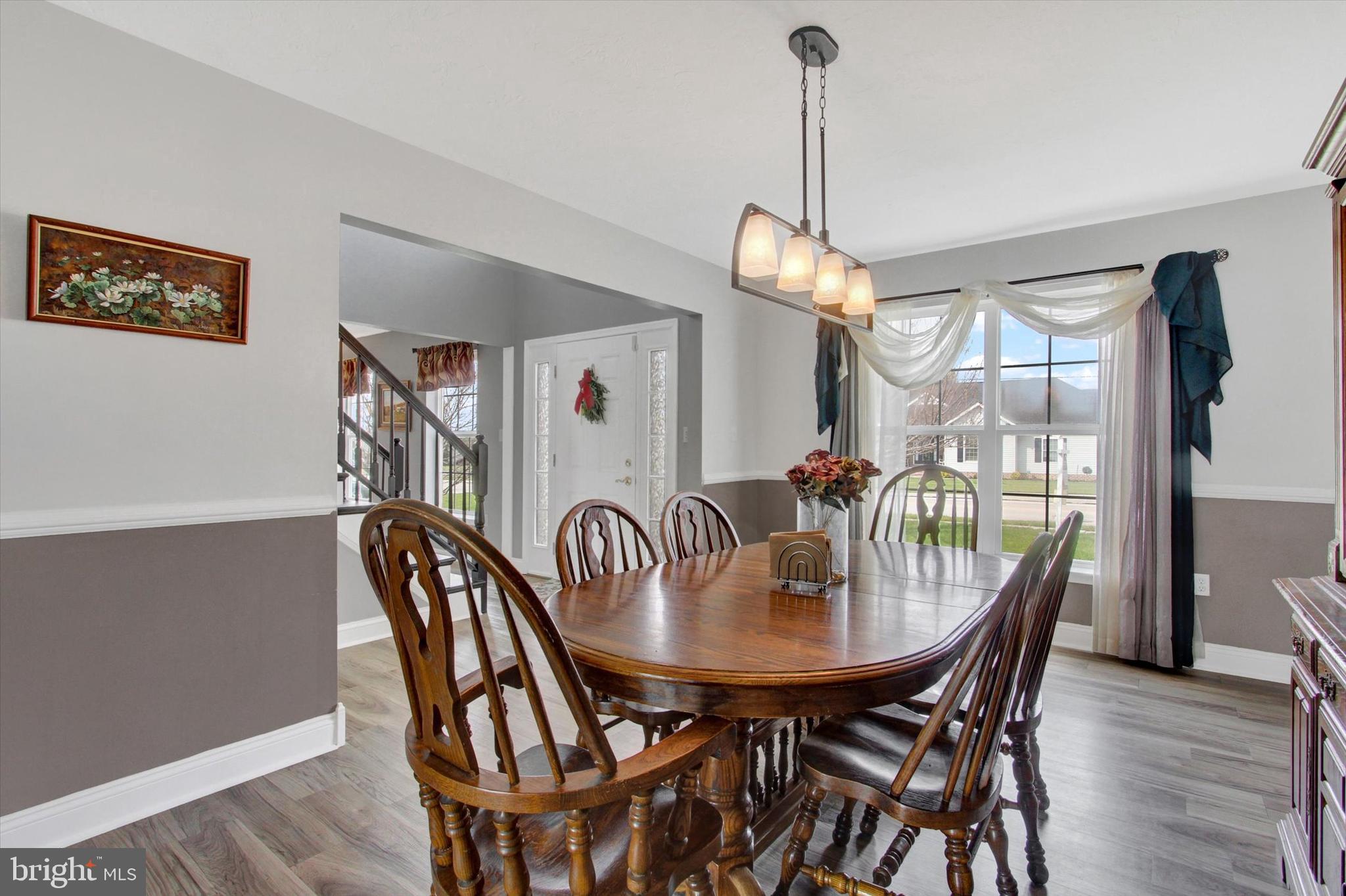 5010 Grandview Road Hanover, PA 17331 - Photo 9 of 42 a dining room with furniture a chandelier and wooden floor