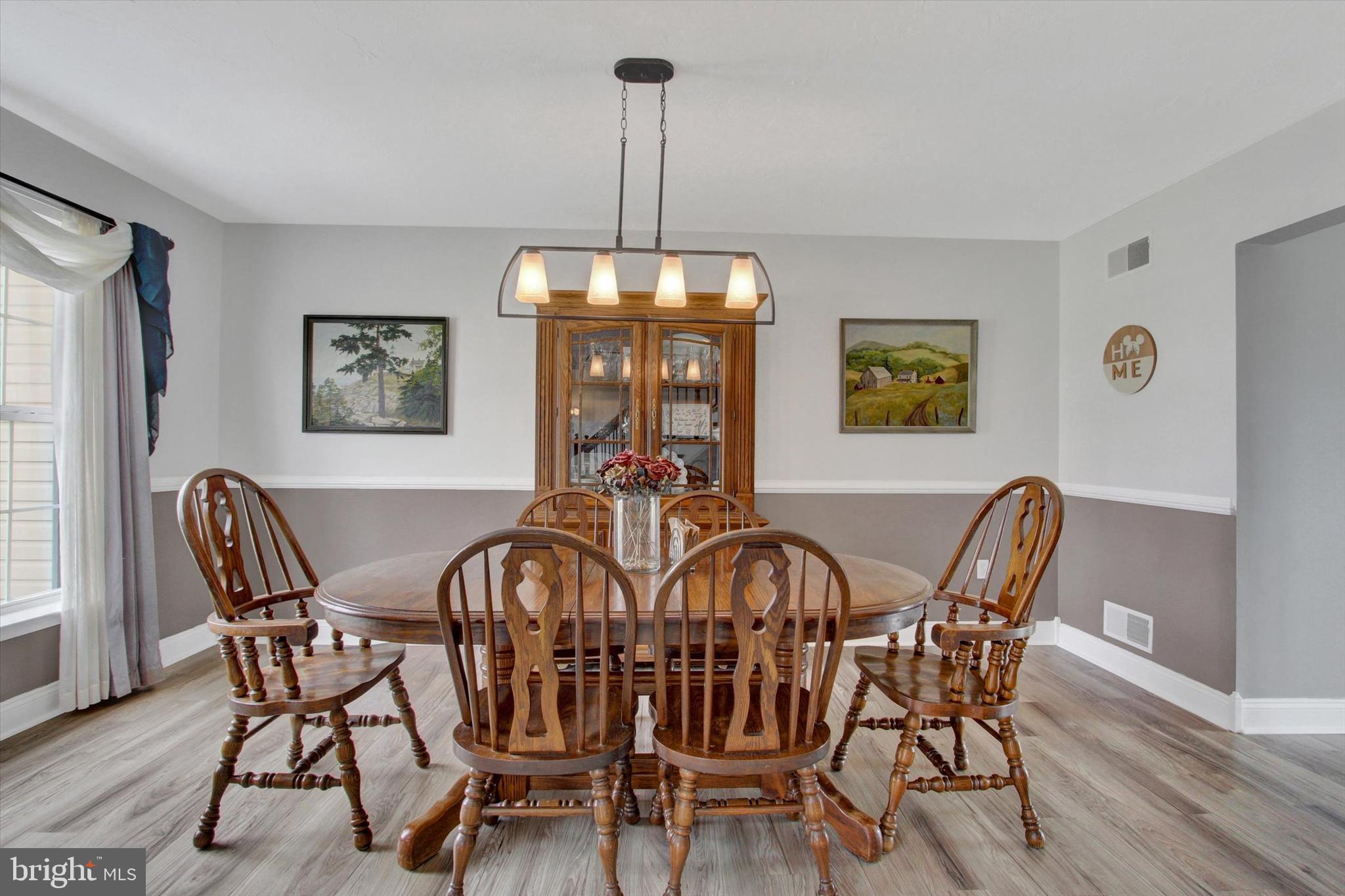 5010 Grandview Road Hanover, PA 17331 - Photo 10 of 42 a view of a dining room with furniture window and wooden floor