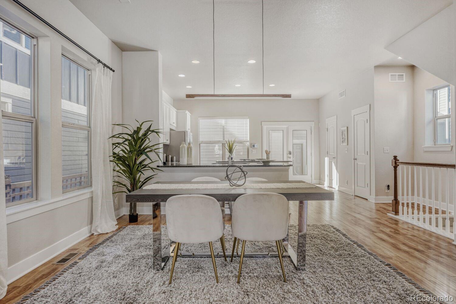 2861 Lima Street Denver, CO 80238 - Photo 12 of 45 a view of a dining room with furniture and window