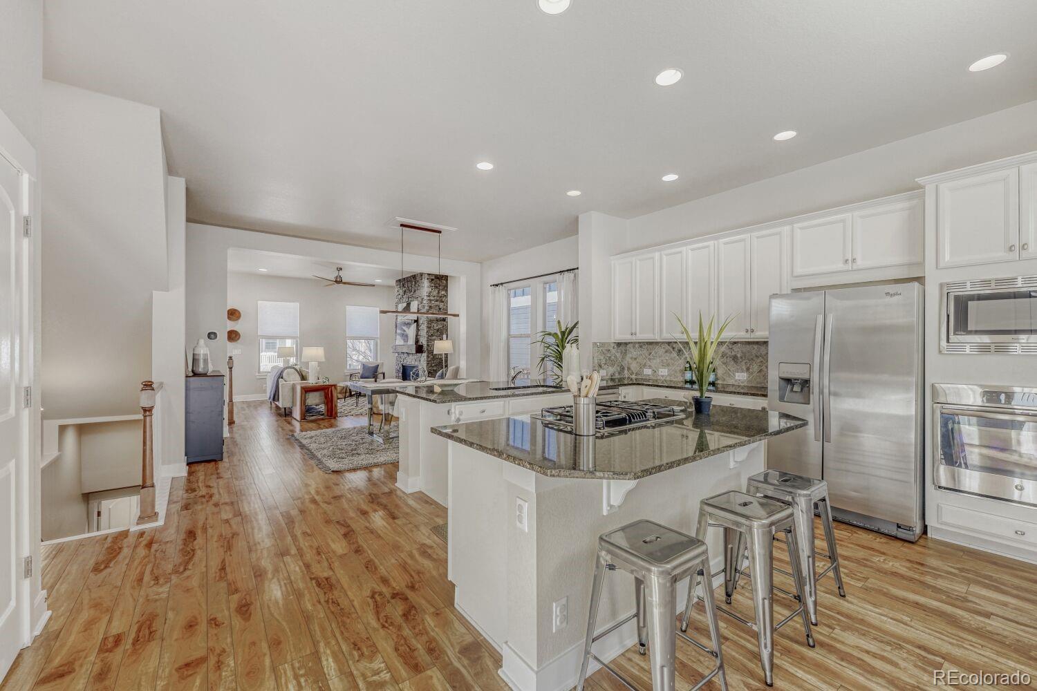 2861 Lima Street Denver, CO 80238 - Photo 13 of 45 a large kitchen with a table and chairs