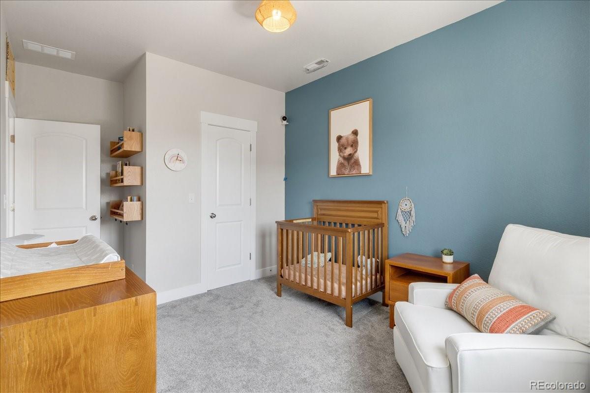 2861 Lima Street Denver, CO 80238 - Photo 21 of 45 a bedroom with furniture and a window