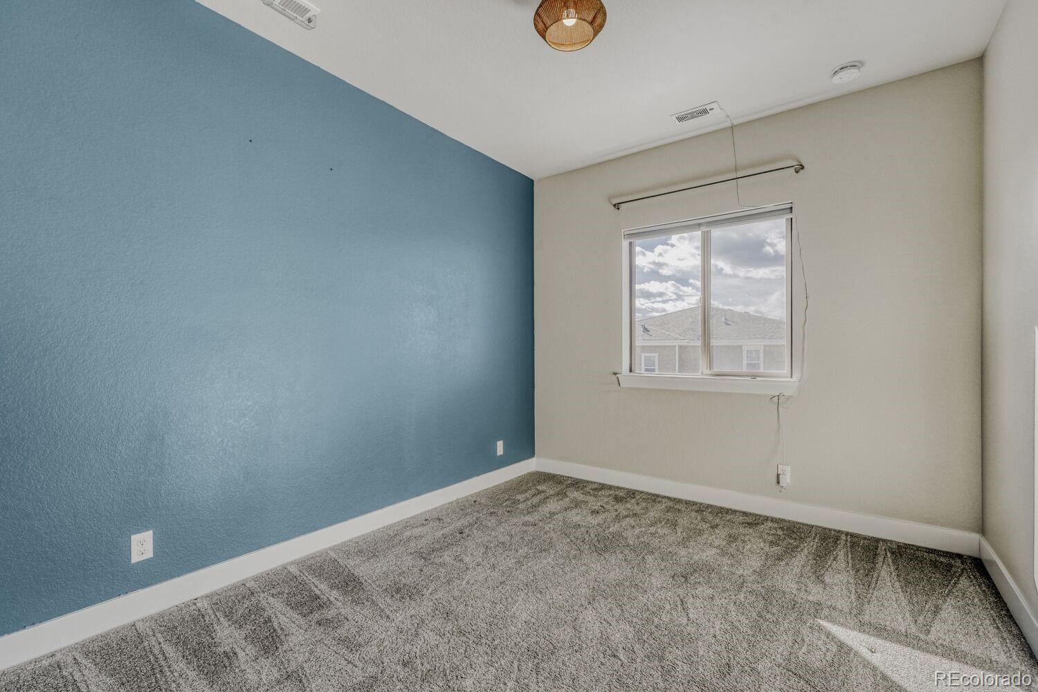 2861 Lima Street Denver, CO 80238 - Photo 23 of 45 an empty room with windows