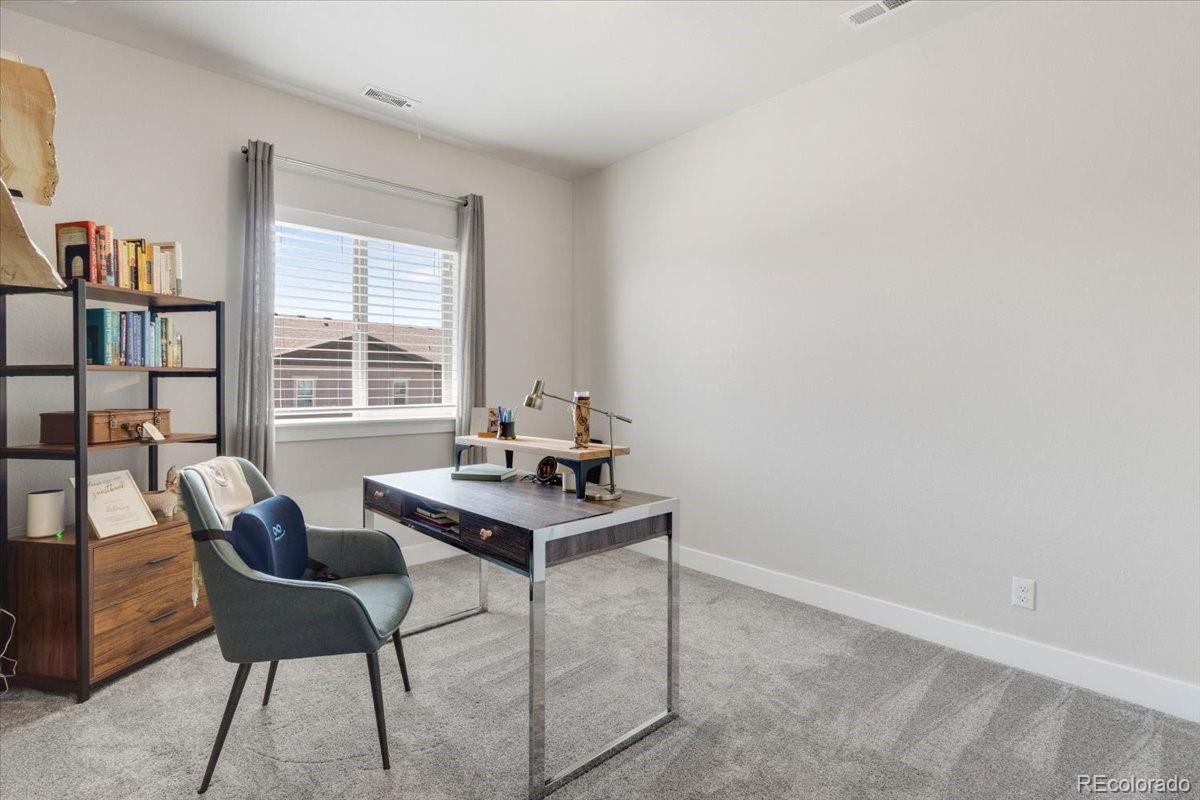 2861 Lima Street Denver, CO 80238 - Photo 24 of 45 a room with furniture and a window