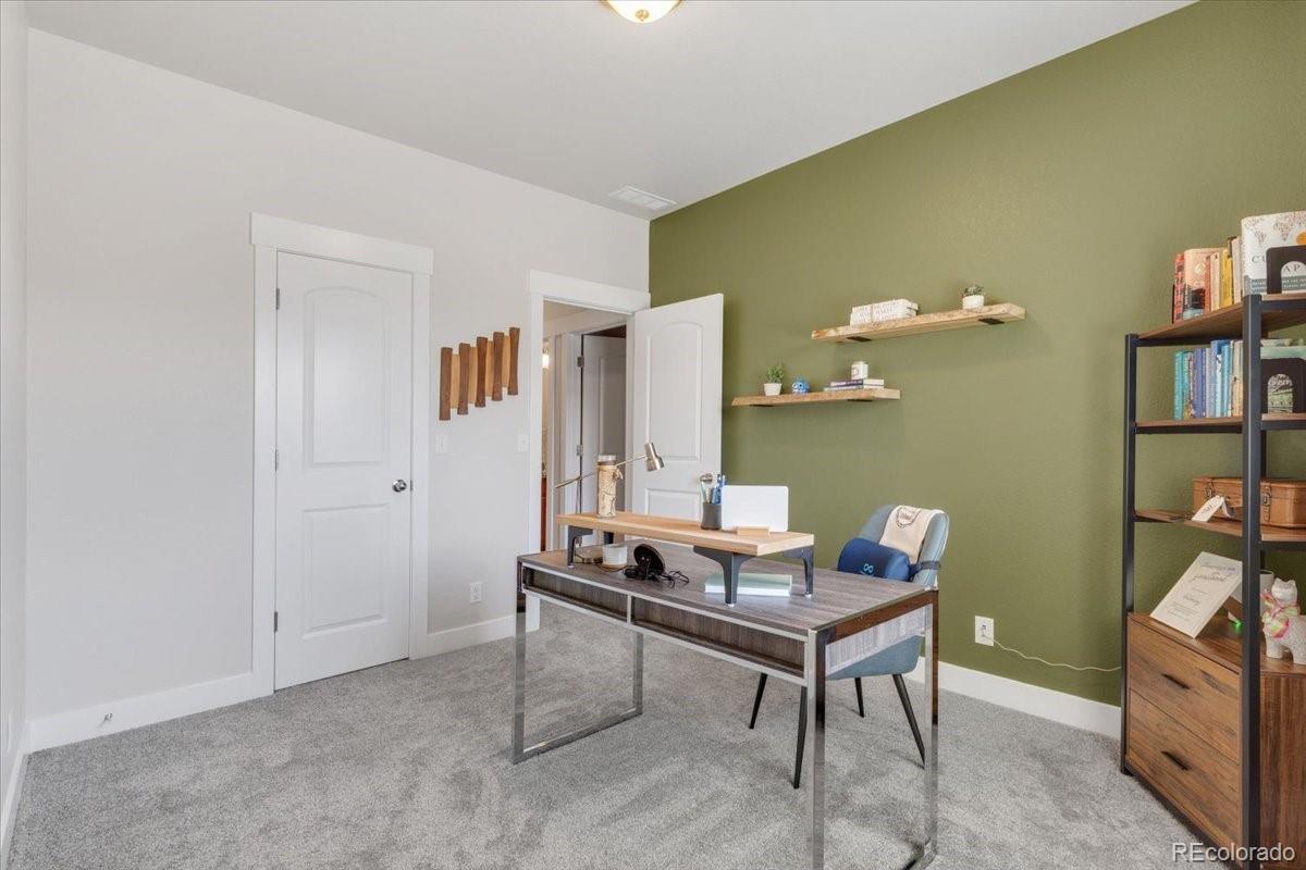 2861 Lima Street Denver, CO 80238 - Photo 25 of 45 a room with furniture and rug