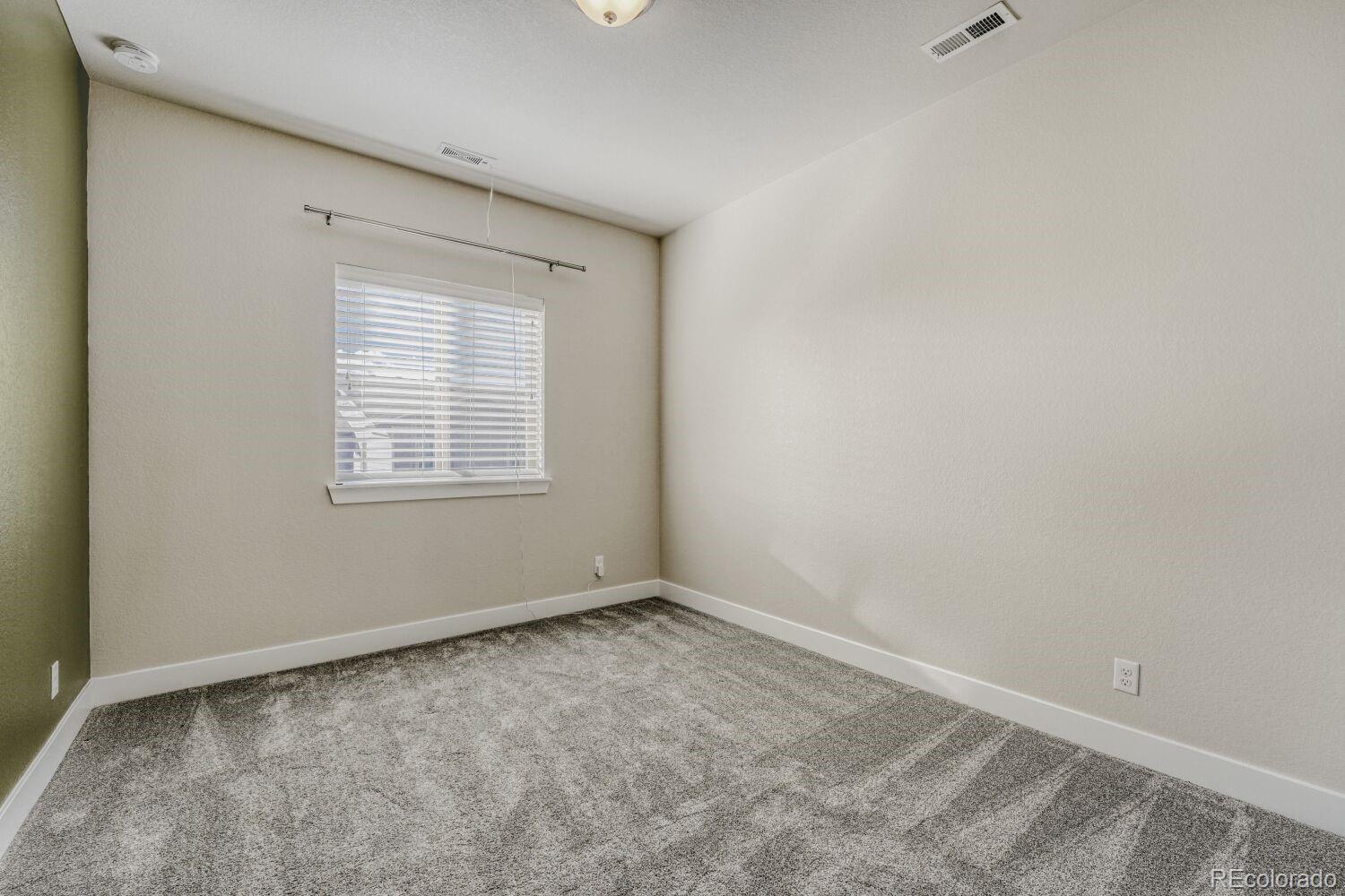 2861 Lima Street Denver, CO 80238 - Photo 26 of 45 an empty room with a window