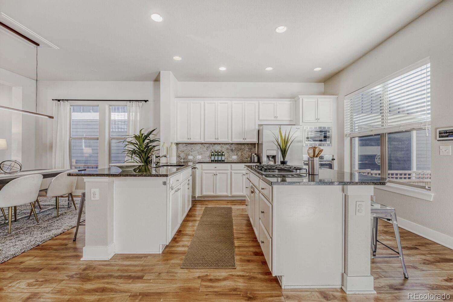 2861 Lima Street Denver, CO 80238 - Photo 5 of 45 a kitchen with counter top space cabinets and appliances