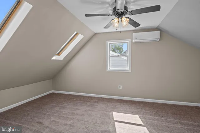 a view of room with window and ceiling fan