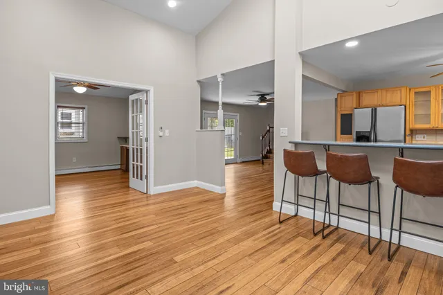 a view of a dining room with furniture and wooden floor