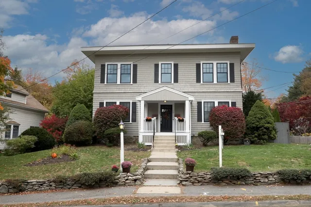 a front view of a house with a yard
