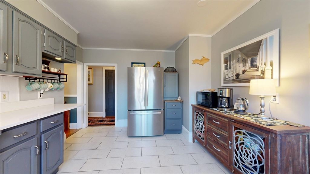 101 King Street, Unit 101 Reading, MA 01867 - Photo 18 of 33 a kitchen with stainless steel appliances a refrigerator and a stove