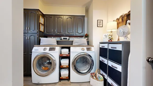 a bedroom with a bed and a flat tv screen on dresser